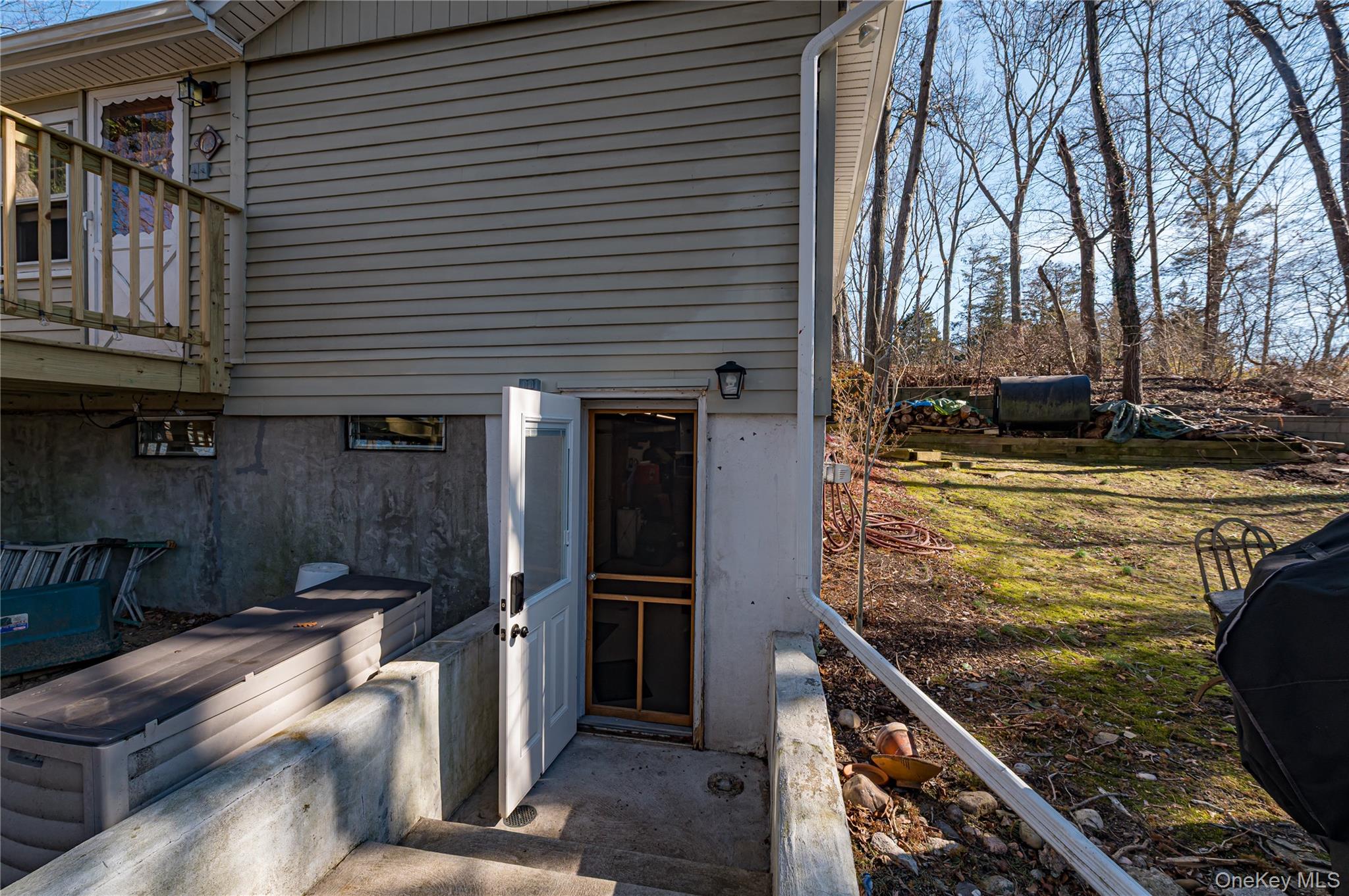75 Herod Point Road Wading River, NY 11792 - Photo 8 of 29 Entrance into basement with interior screen door