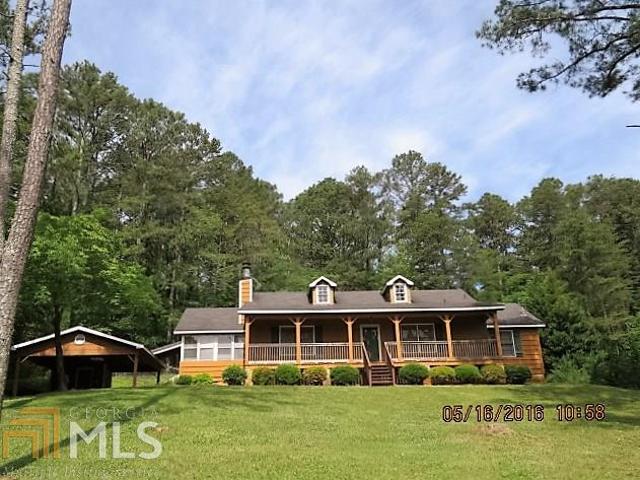 243 Margo Trail Southeast, Unit 65 Rome, GA 30161 - Photo 1 of 1 a front view of a house with garden