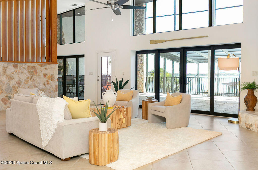 110 Barnacle Place Rockledge, FL 32955 - Photo 14 of 71 a living room with furniture and large windows