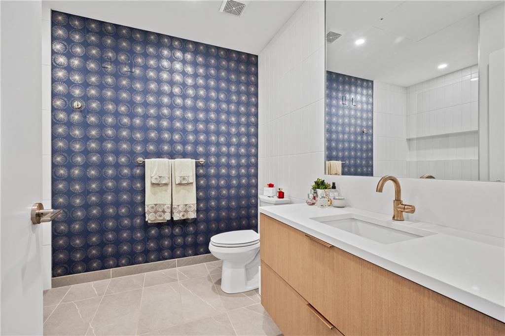 2554 Smallman Street, Unit 504 Pittsburgh, PA 15222 - Photo 19 of 29 a bathroom with a sink toilet and shower
