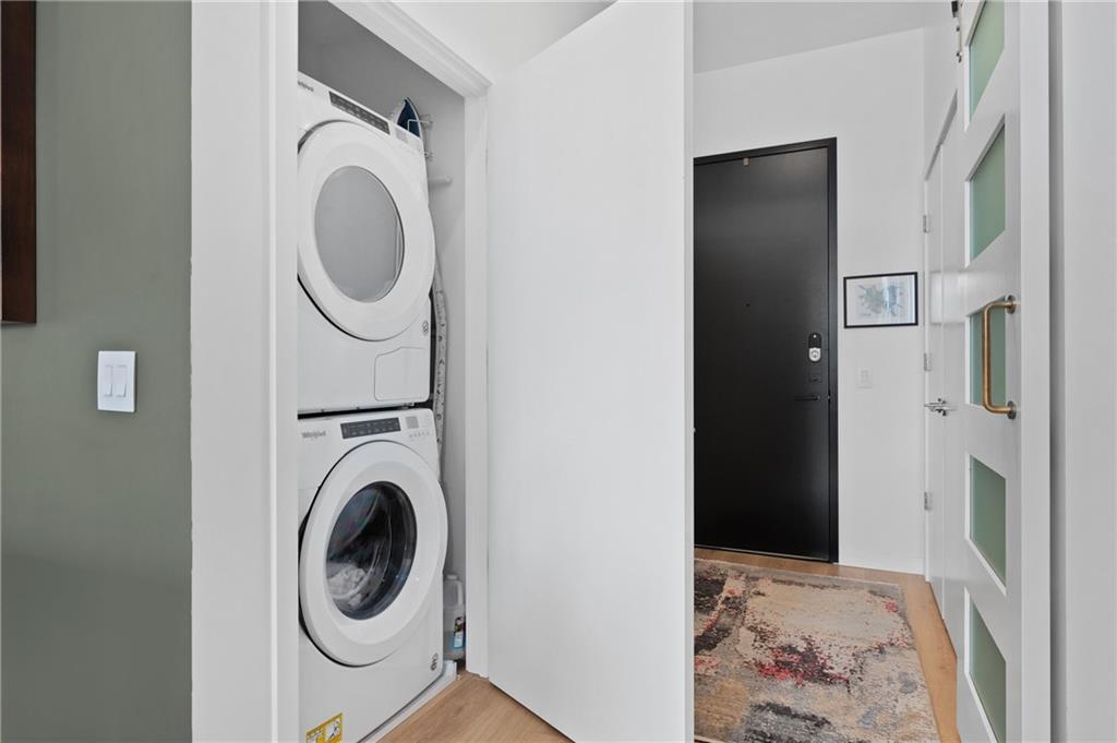 2554 Smallman Street, Unit 504 Pittsburgh, PA 15222 - Photo 21 of 29 a view of a hallway with washer and dryer