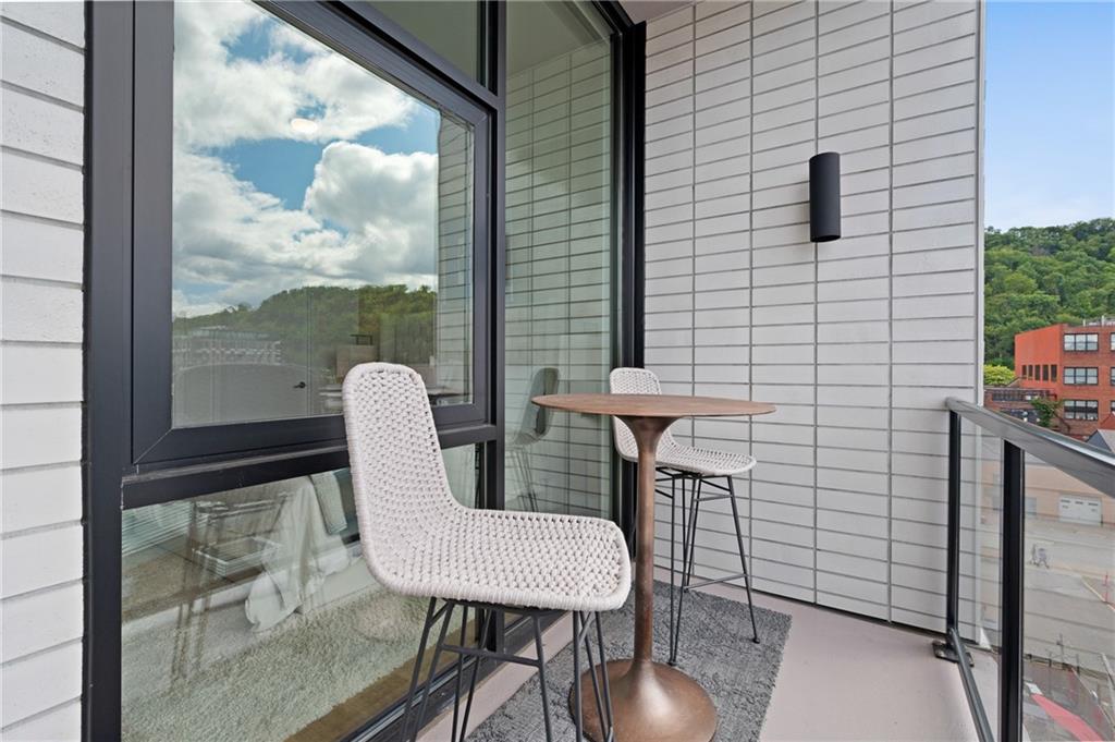 2554 Smallman Street, Unit 504 Pittsburgh, PA 15222 - Photo 22 of 29 a view of a chairs and table in patio