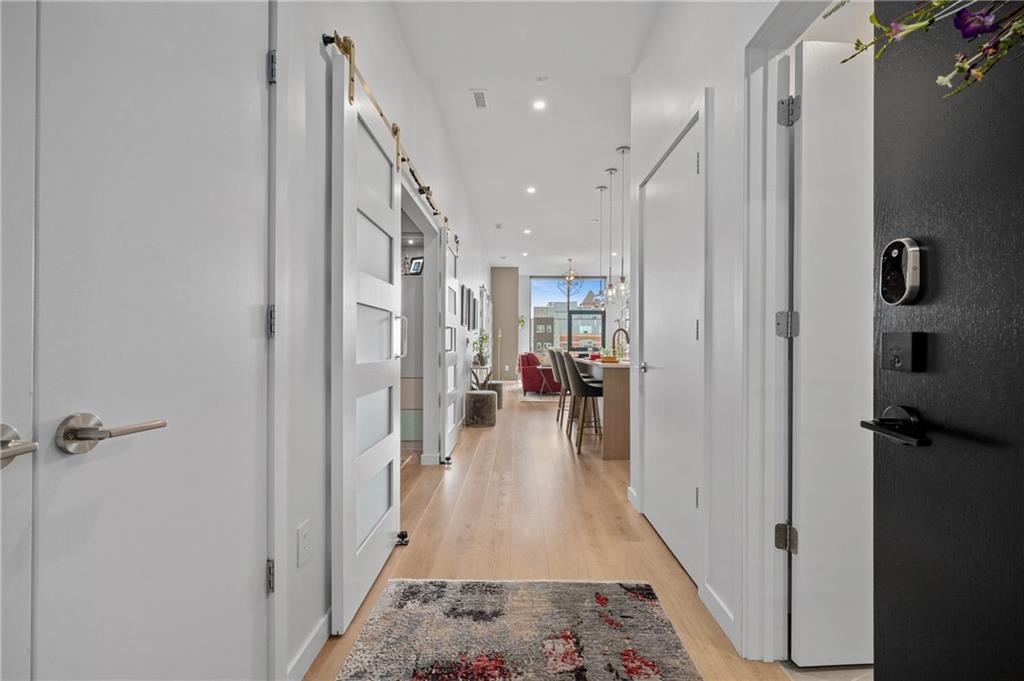2554 Smallman Street, Unit 504 Pittsburgh, PA 15222 - Photo 10 of 29 a hallway with a view of living room