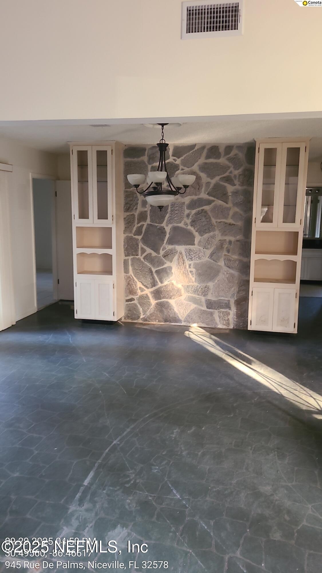 945 Rue De Palms Niceville, FL 32578 - Photo 6 of 37 a view of an empty room with a cabinet