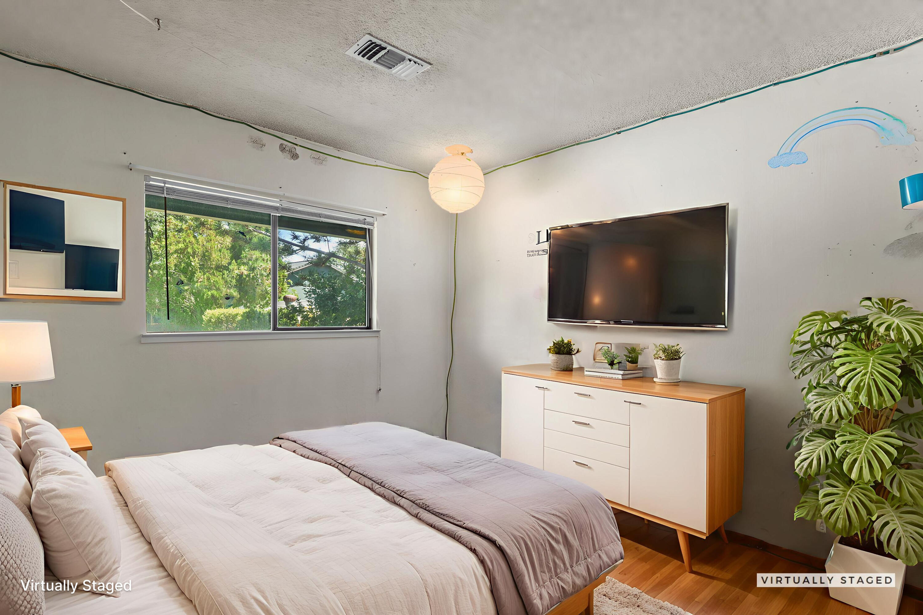 2760 Oriole Drive Red Bluff, CA 96080 - Photo 15 of 25 a bedroom with a flat screen tv and a potted plant