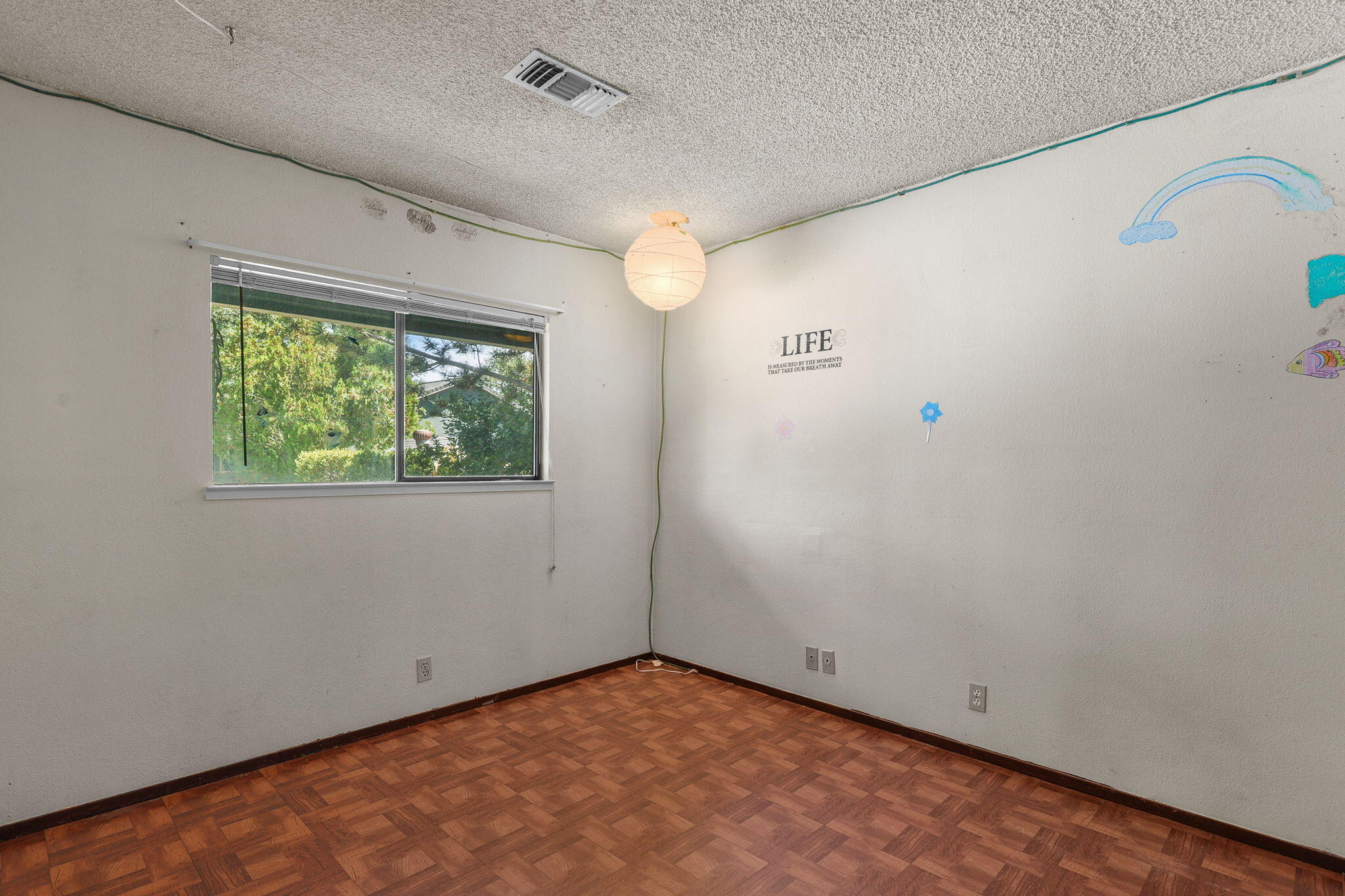 2760 Oriole Drive Red Bluff, CA 96080 - Photo 16 of 25 an empty room with a window and a ceiling fan