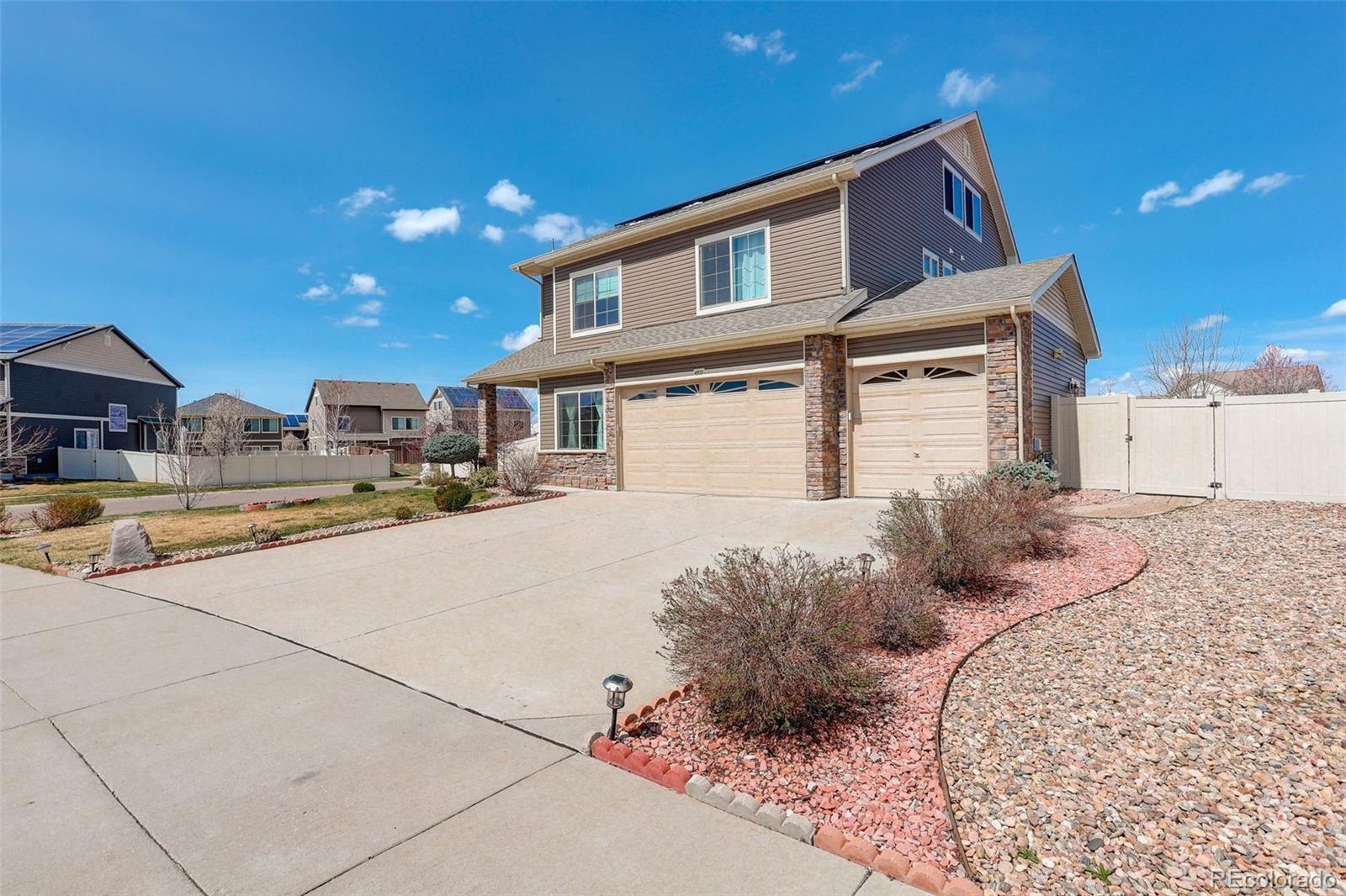 4971 Ceylon Way Denver, CO 80249 - Photo 2 of 40 a house view with a outdoor space