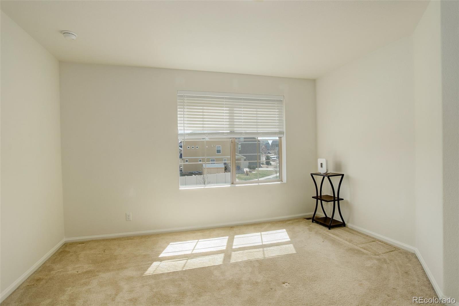 4971 Ceylon Way Denver, CO 80249 - Photo 26 of 40 an empty room with a window