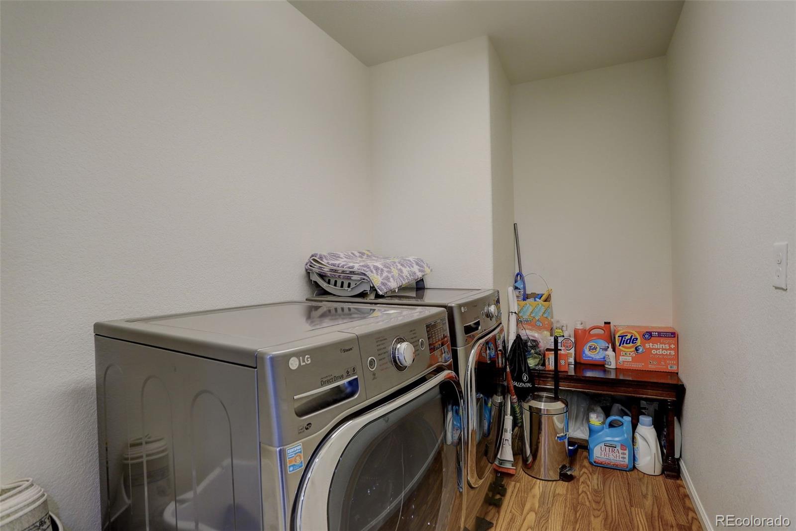 4971 Ceylon Way Denver, CO 80249 - Photo 28 of 40 a utility room with dryer and washer