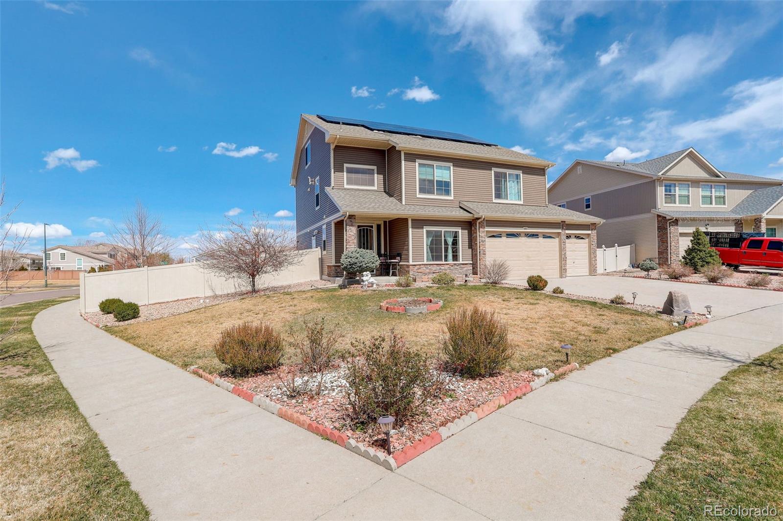 4971 Ceylon Way Denver, CO 80249 - Photo 3 of 40 a view of a house with a patio