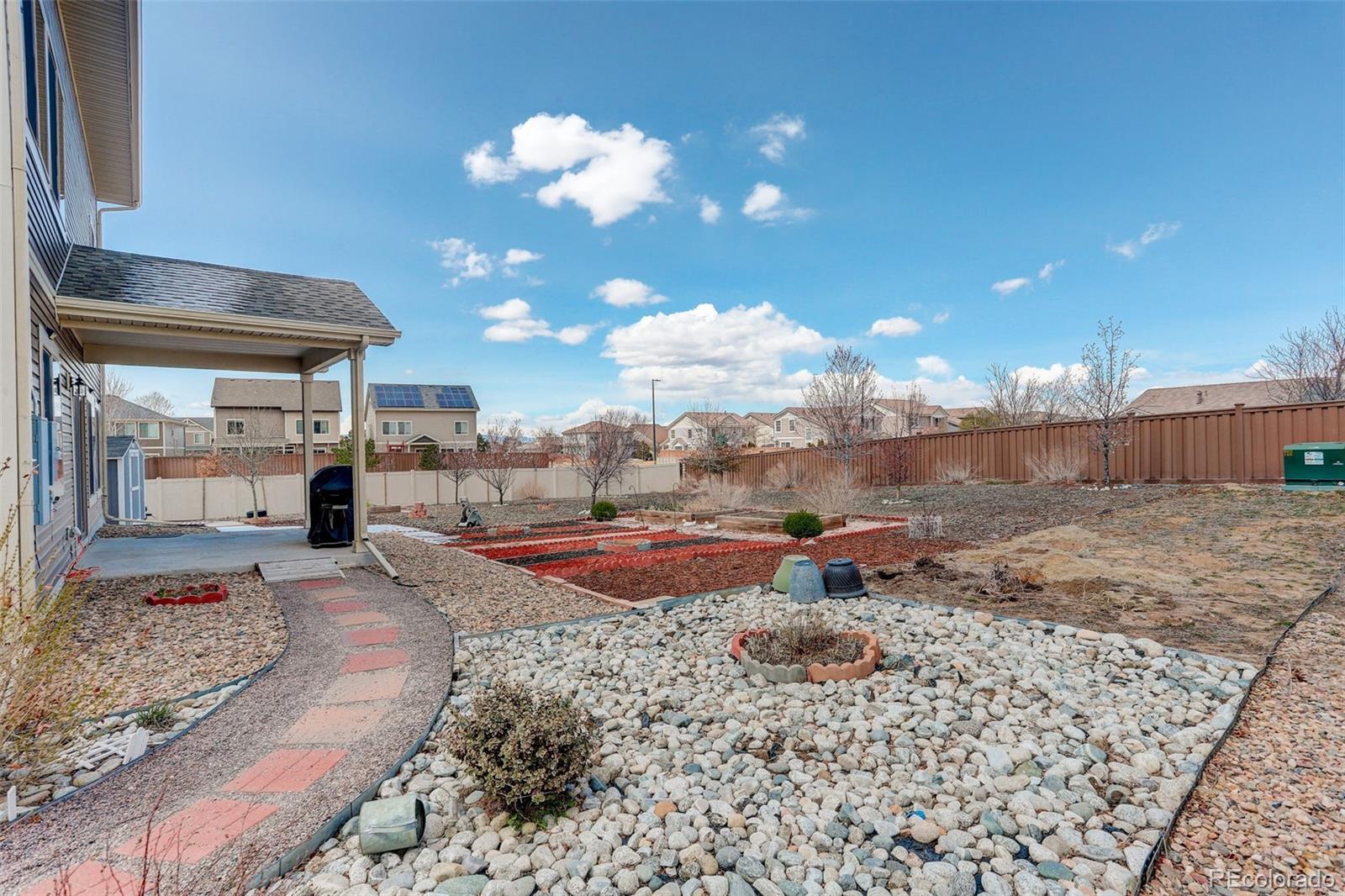 4971 Ceylon Way Denver, CO 80249 - Photo 33 of 40 a view of a backyard of a house