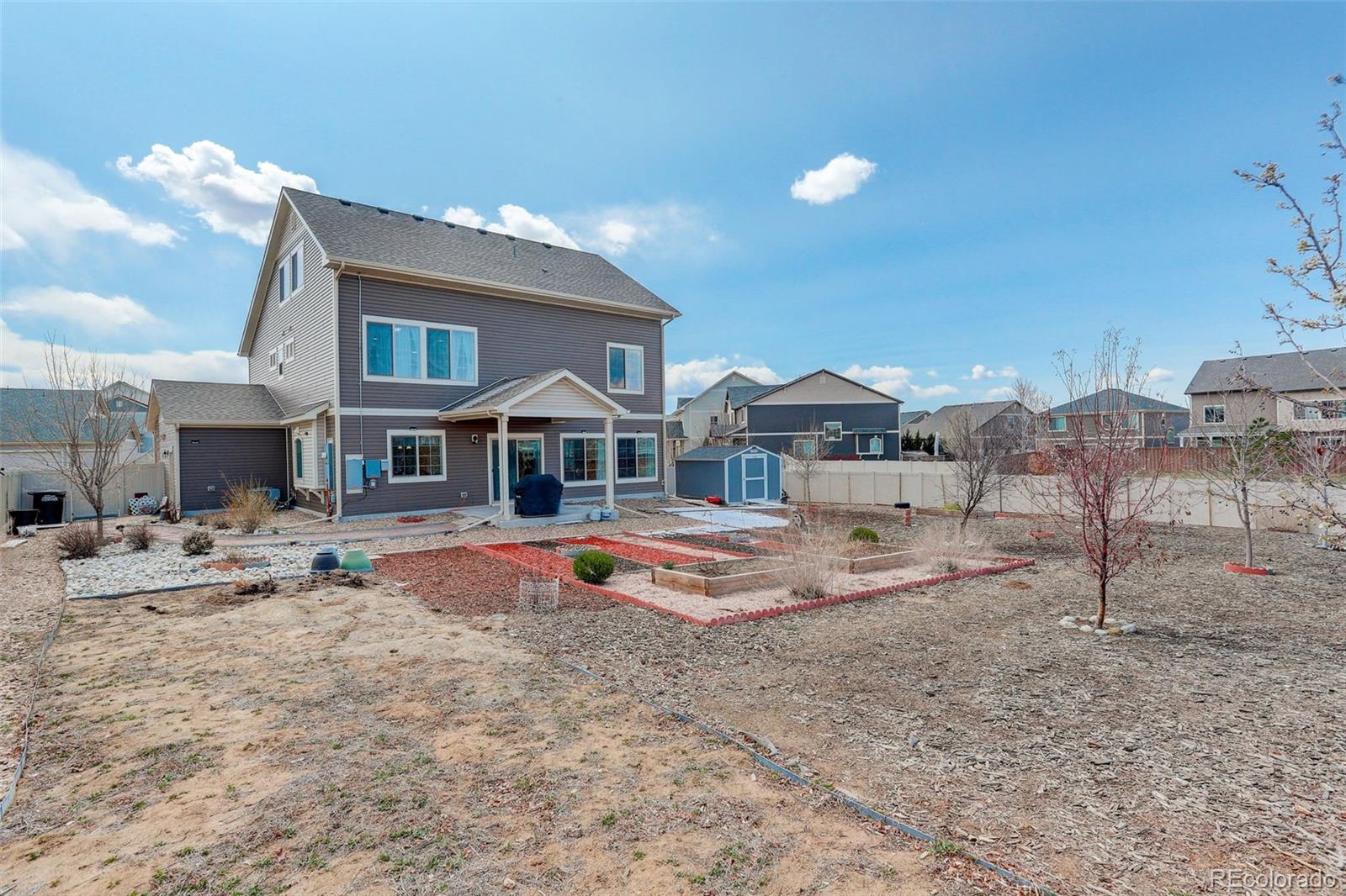 4971 Ceylon Way Denver, CO 80249 - Photo 35 of 40 a view of a house with swimming pool and sitting area