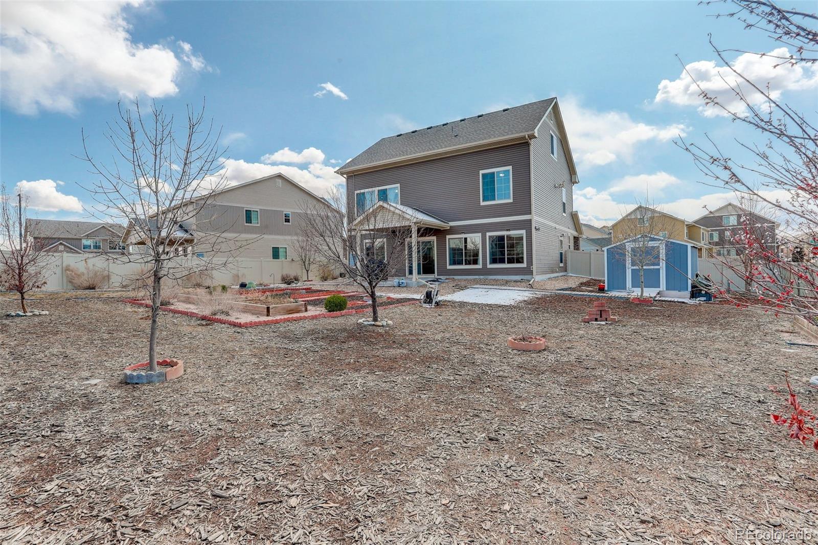 4971 Ceylon Way Denver, CO 80249 - Photo 36 of 40 a view of a house with a snow