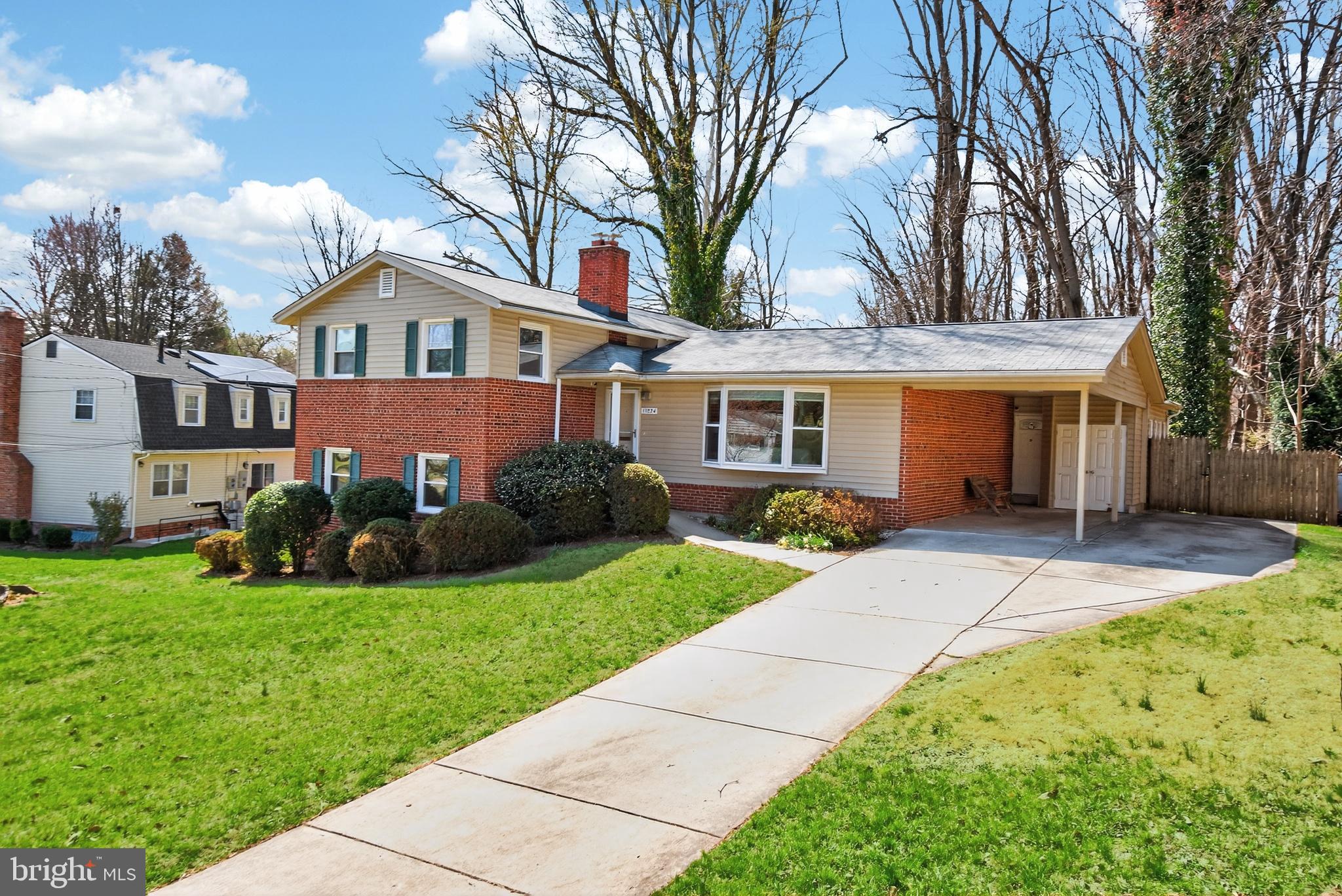 11004 Oakwood Street Silver Spring, MD 20901 - Photo 2 of 35 a front view of a house with a yard