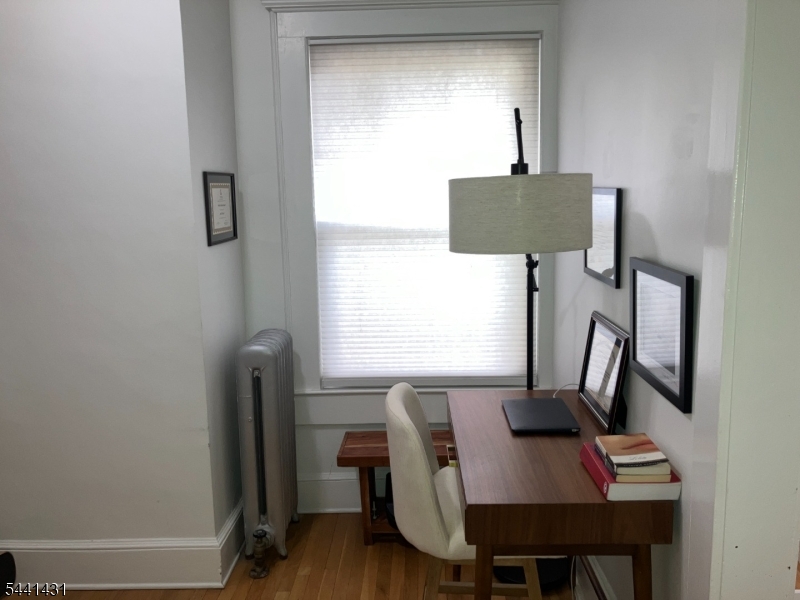 306 Springfield Avenue, Unit 1 Summit, NJ 07901 - Photo 17 of 17 a view of a workspace with furniture and a window