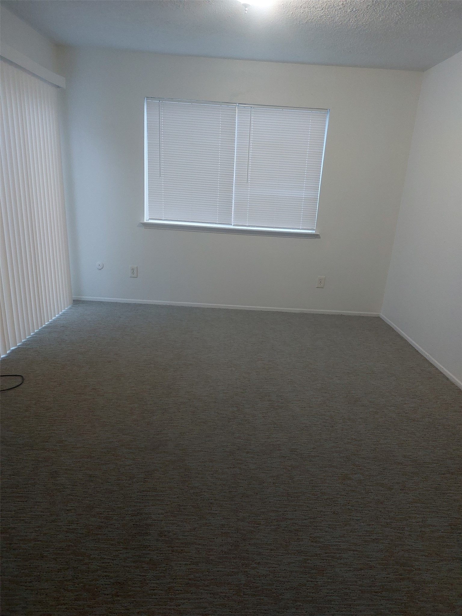 8151 Misty Ridge Lane Houston, TX 77071 - Photo 12 of 15 an empty room with a window
