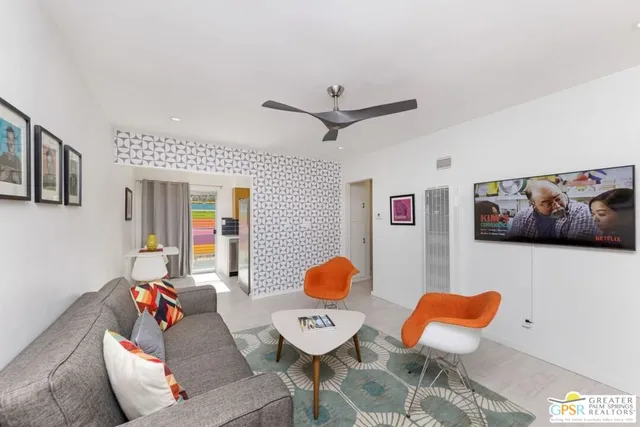 a living room with furniture and a rug