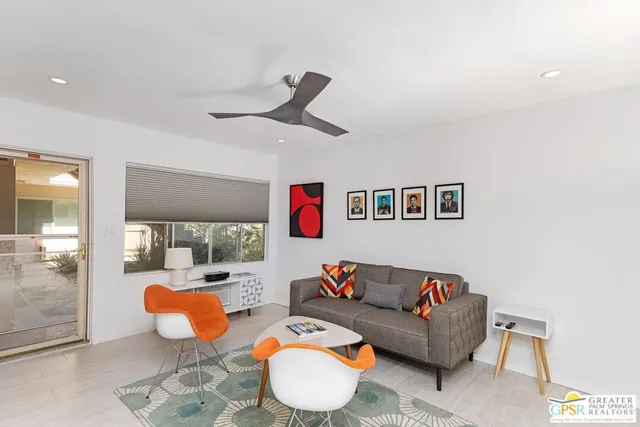 a living room with furniture and a rug