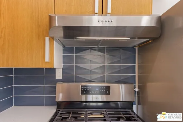 a view of a dining room with a table and chairs