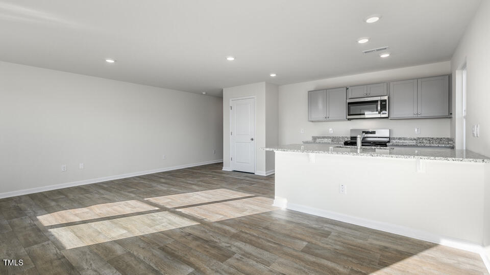 38 Red Clover Drive Angier, NC 27501 - Photo 17 of 37 Living and Dining Area