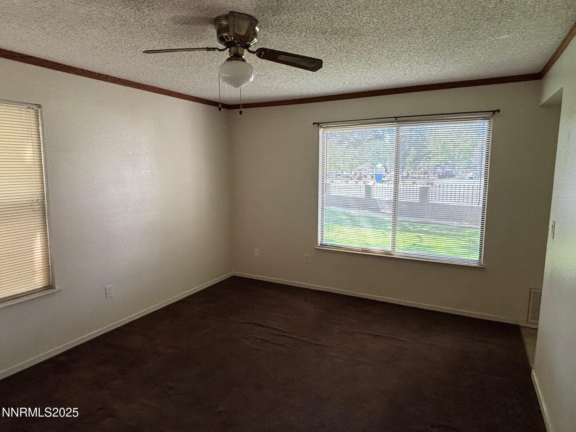 1465 East Peckham Lane, Unit 53 Reno, NV 89502 - Photo 8 of 19 a view of an empty room with a window