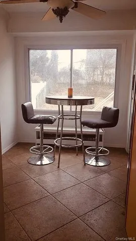 a view of workspace with wooden floor and windows