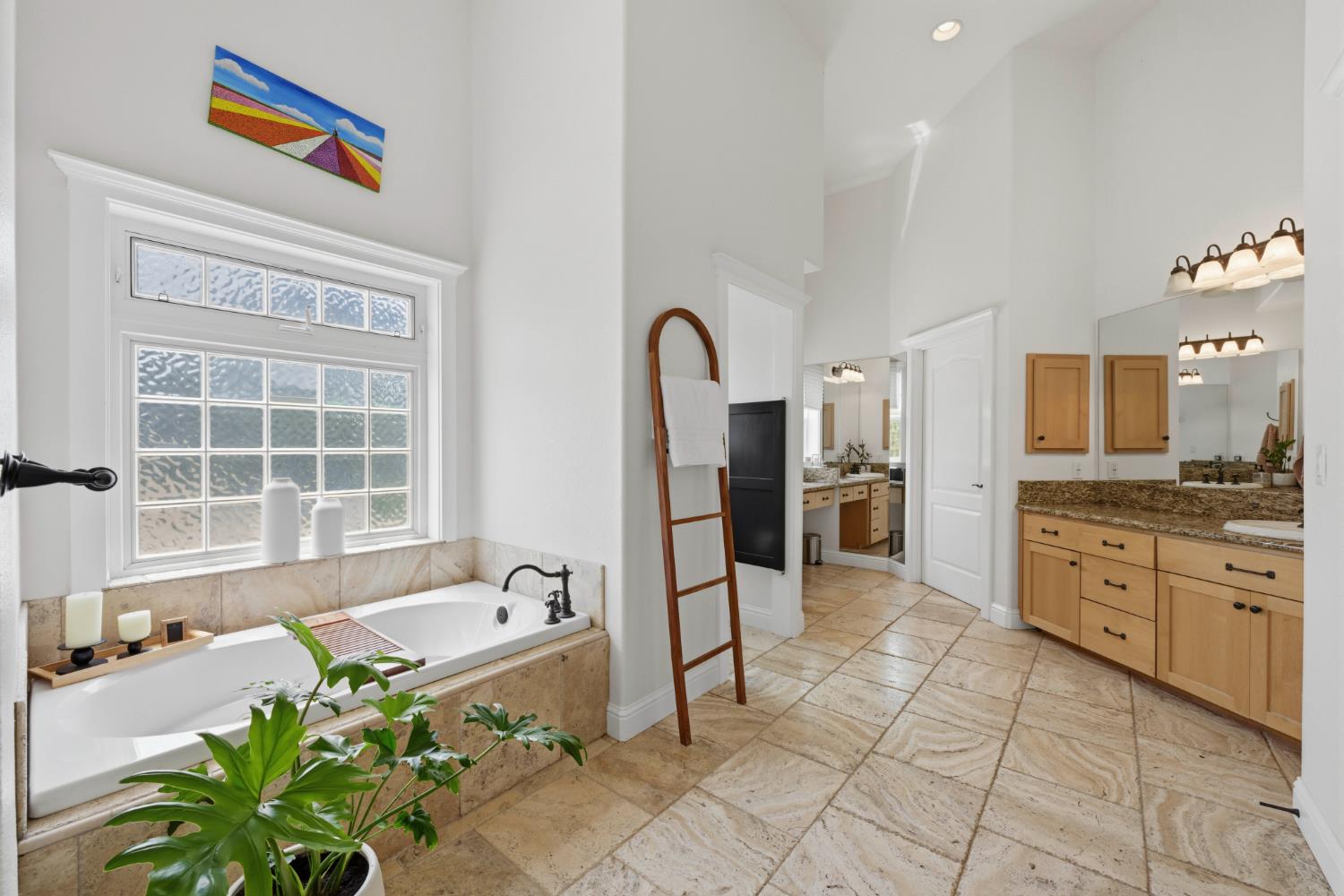 10120 Shenandoah Road Plymouth, CA 95669 - Photo 65 of 86 a spacious bathroom with a granite countertop sink a bathtub and a shower