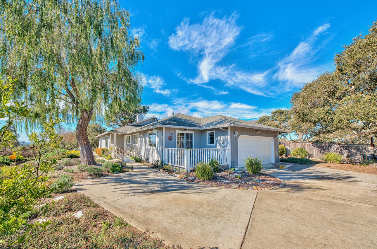 18401 Moro Road Salinas, CA 93907 - Photo 1 of 39 a front view of a house with a yard and potted plants