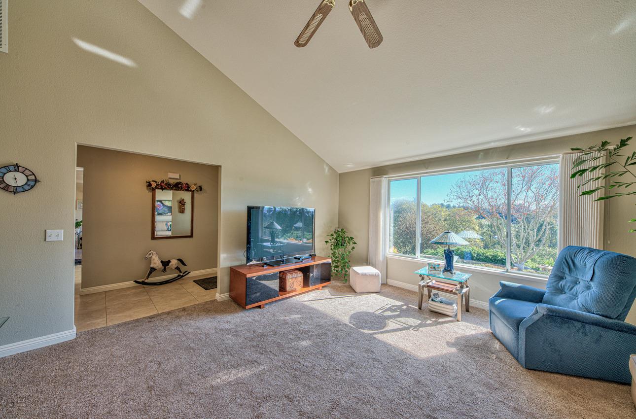 18401 Moro Road Salinas, CA 93907 - Photo 11 of 39 a living room with furniture and a flat screen tv