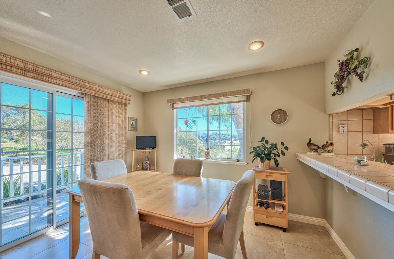 18401 Moro Road Salinas, CA 93907 - Photo 15 of 39 a living room with furniture a dining table and a large window
