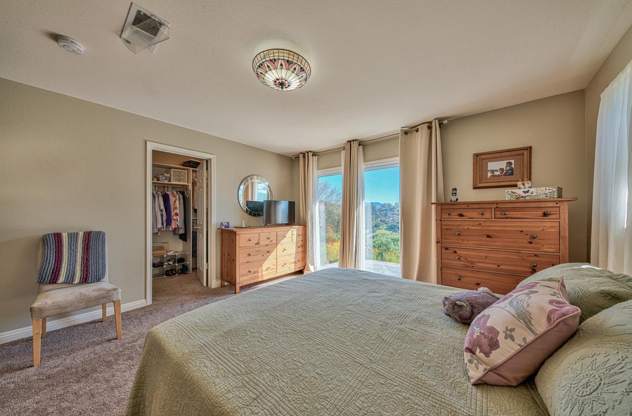 18401 Moro Road Salinas, CA 93907 - Photo 22 of 39 a bedroom with a large bed and a couch