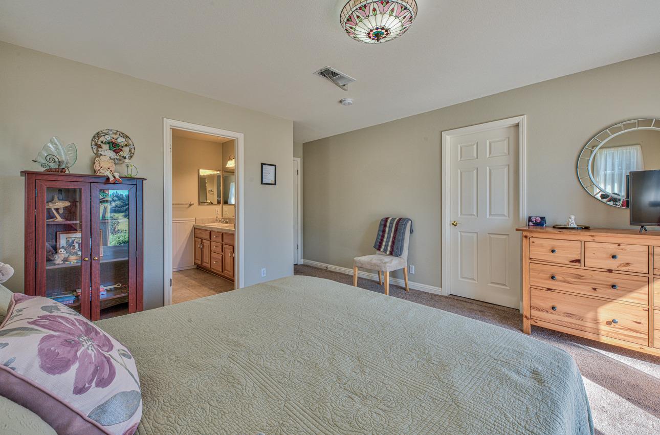 18401 Moro Road Salinas, CA 93907 - Photo 23 of 39 a bedroom with a bed and a dresser in it