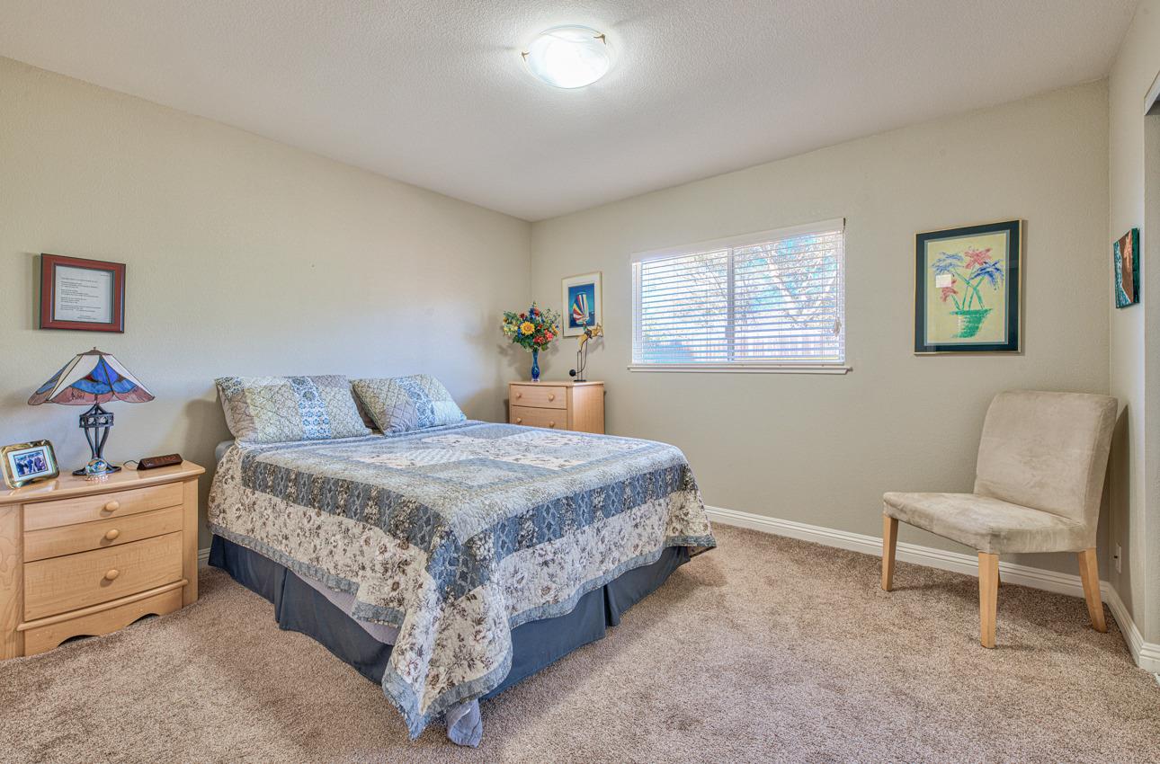 18401 Moro Road Salinas, CA 93907 - Photo 26 of 39 a bedroom with a bed and a chair