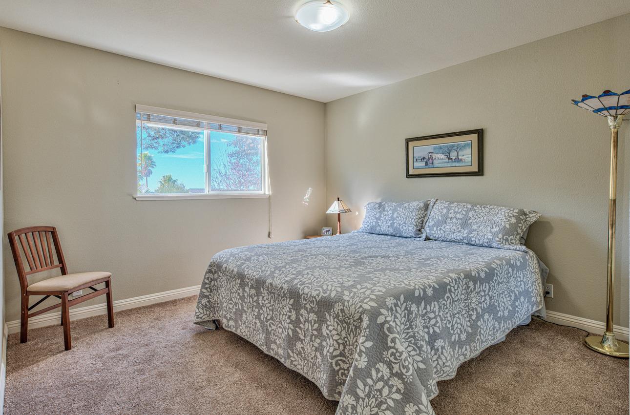18401 Moro Road Salinas, CA 93907 - Photo 28 of 39 a bed room with a bed and a chair