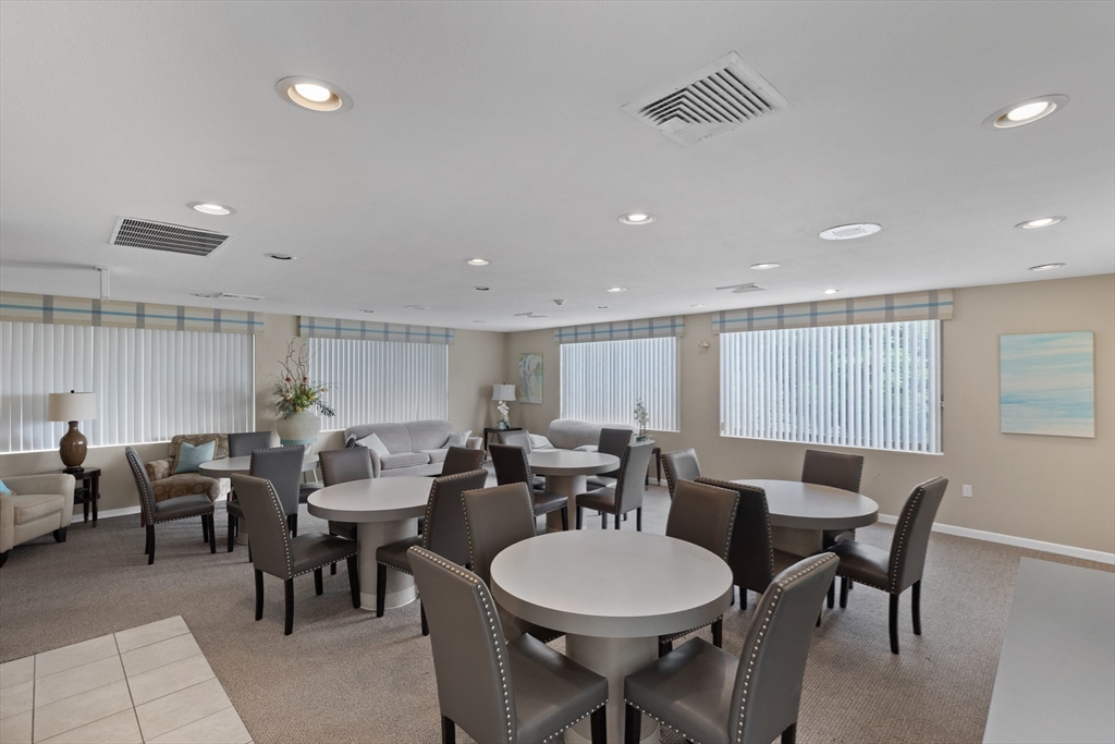 1006 Paradise Road, Unit 1A Swampscott, MA 01907 - Photo 14 of 18 a view of a dining room with furniture