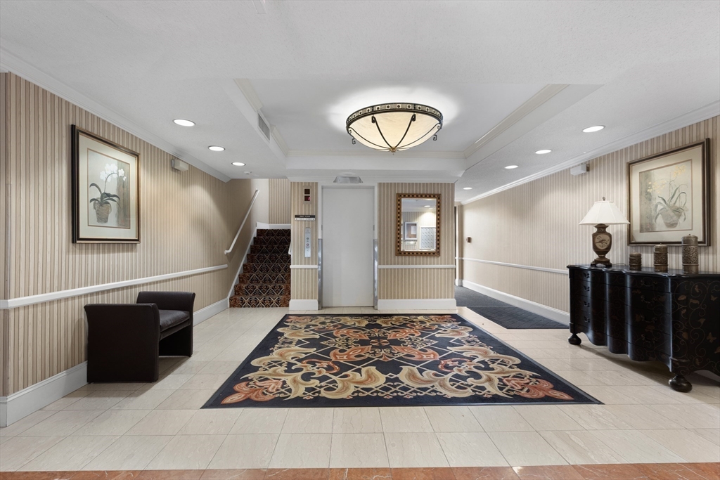 1006 Paradise Road, Unit 1A Swampscott, MA 01907 - Photo 2 of 18 a view of a livingroom with furniture and window