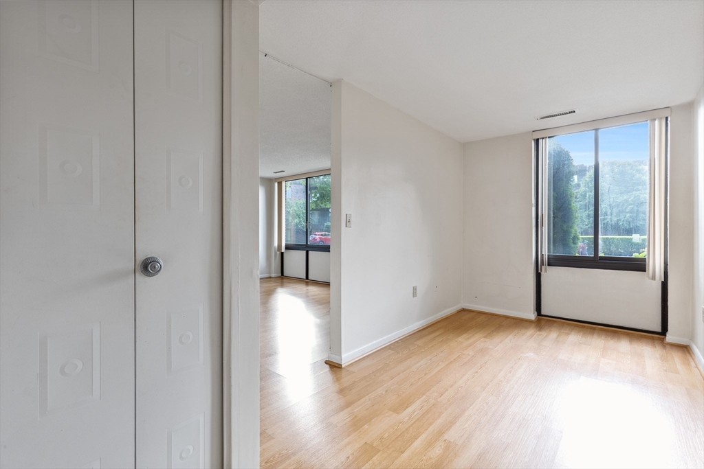 1006 Paradise Road, Unit 1A Swampscott, MA 01907 - Photo 6 of 18 a view of an empty room and window
