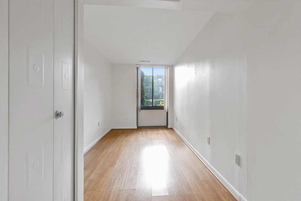1006 Paradise Road, Unit 1A Swampscott, MA 01907 - Photo 7 of 18 a view of hallway with wooden floor