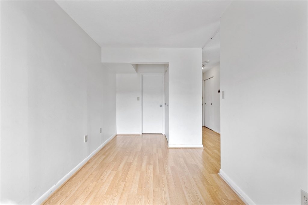 1006 Paradise Road, Unit 1A Swampscott, MA 01907 - Photo 8 of 18 a view of a room with wooden floor