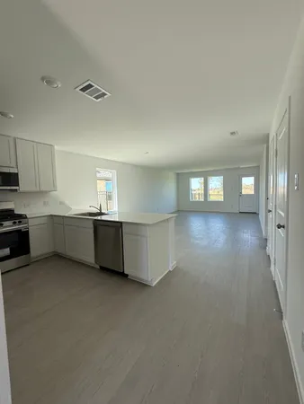 a view of a kitchen with kitchen and a sink