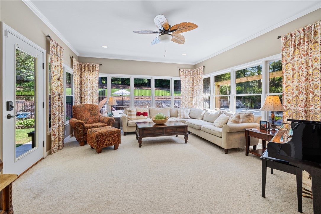 308 Amethyst Way Seneca, SC 29672 - Photo 19 of 49 Enjoy year-round sunlight in the spacious sunroom overlooking a private backyard oasis.