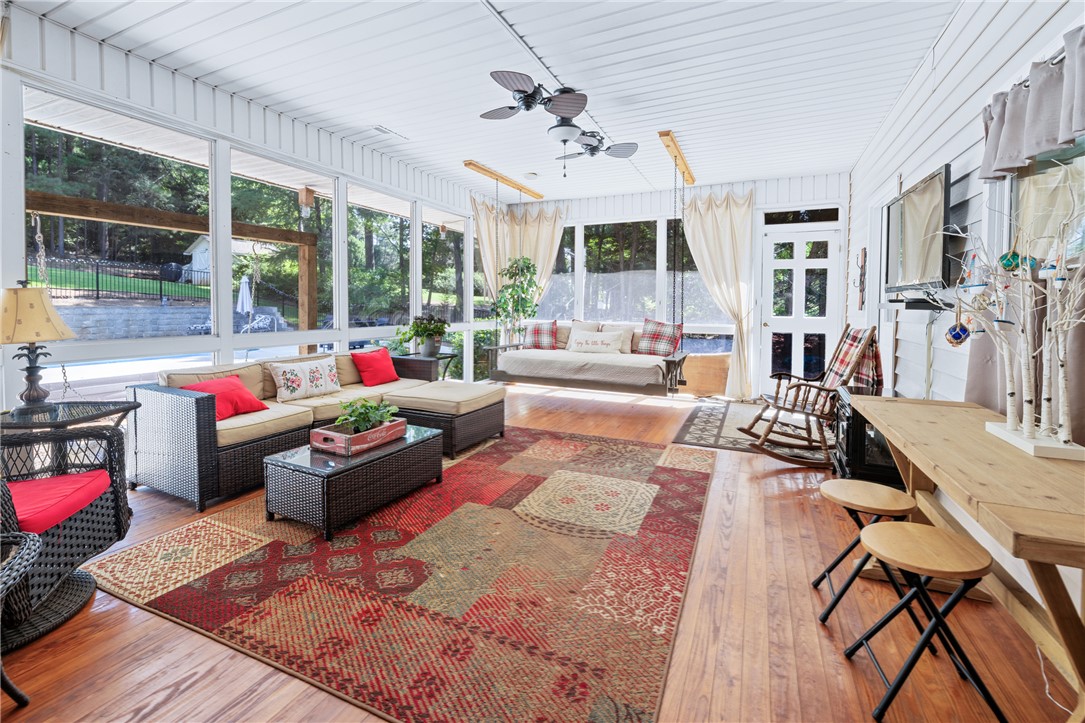 308 Amethyst Way Seneca, SC 29672 - Photo 30 of 49 Unwind on the three-season porch featuring removable plexiglass panels and screens, with upstairs HVAC ducting extended to provide maximum comfort and flexibility in every season.