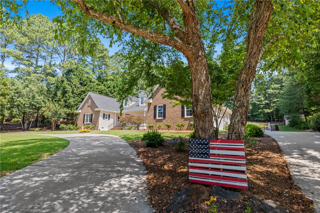 308 Amethyst Way Seneca, SC 29672 - Photo 3 of 49 while a secondary drive leads to the attached garage and extra guest parking.