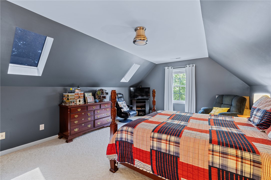 308 Amethyst Way Seneca, SC 29672 - Photo 38 of 49 Upstairs, a private guest suite offers skylights, architectural charm, two closets, and a full bath with walk-in shower.
