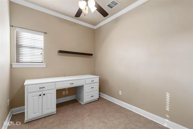 a room with a white cabinets and a window