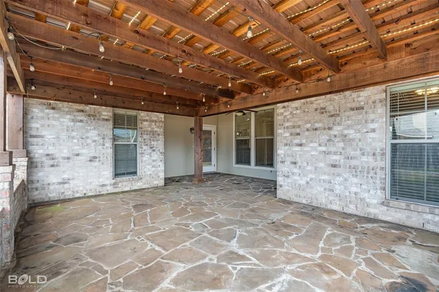 a view of an empty room with a balcony