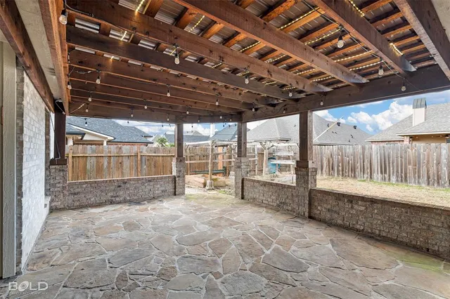 a view of a hallway with wooden floor and a living room