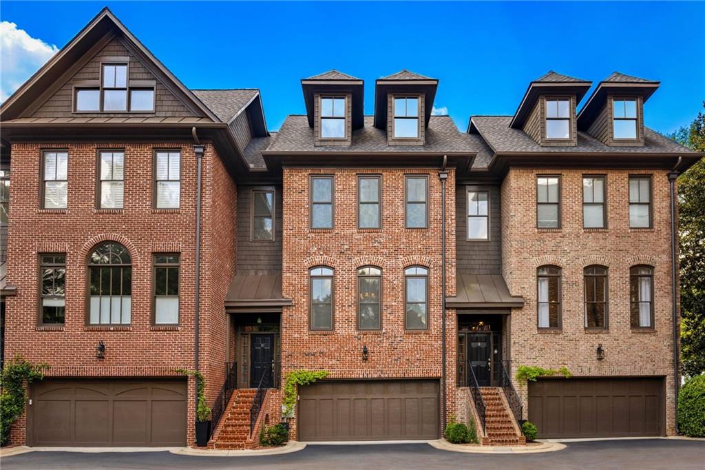 4222 Rickenbacker Way Northeast, Unit 11 Atlanta, GA 30342 - Photo 1 of 1 a front view of a house