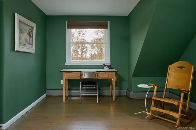 a bathroom with a sink a toilet and window