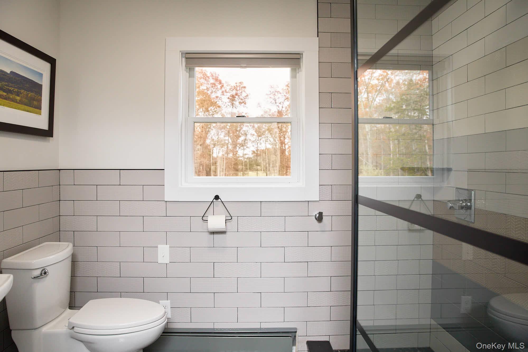 2917 Rte 44 55 Gardiner, NY 12525 - Photo 28 of 33 a bathroom with a sink a toilet and window